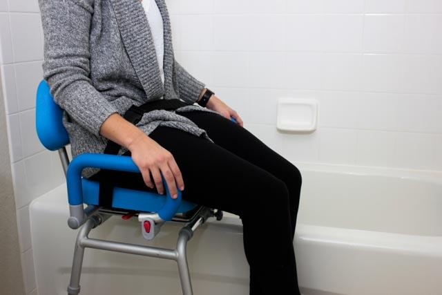 sliding transfer bench with swivel seat - person getting into bathtub